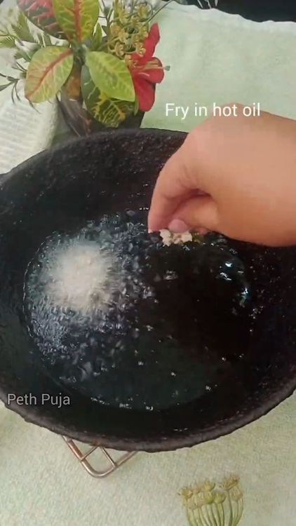 Step 1.1: Heat peanut oil in a deep-bottom pan over medium heat