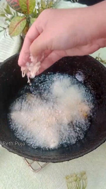 Step 1.2: Heat peanut oil in a deep-bottom pan over medium heat