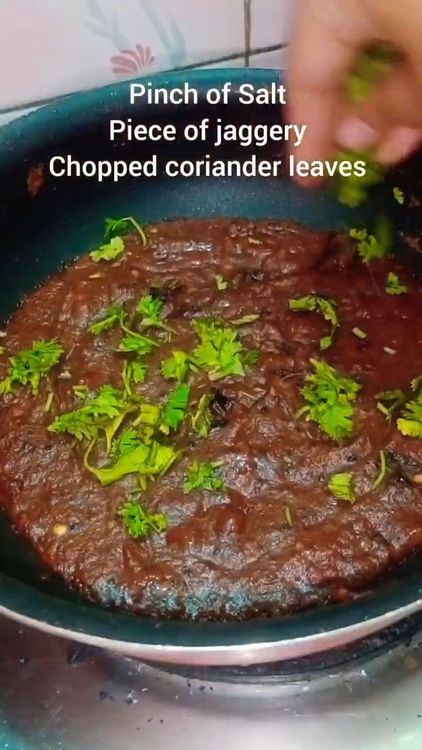 Step 3.1: Once the oil separates, add some coriander leaves