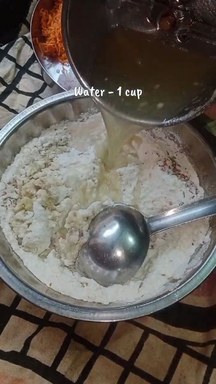 Step 1.4: In a bowl, combine the bottle gourd paste, sooji, rice flour, chilli flakes, cumin seeds, and salt