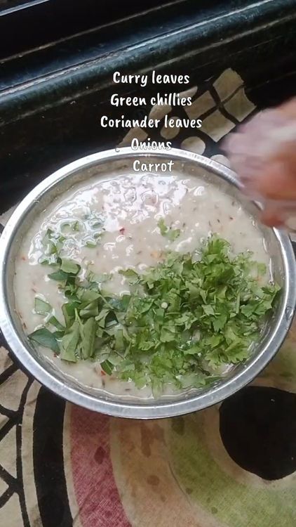 Step 1.1: Add curry leaves, chopped green chillies, chopped coriander leaves, chopped onion, and grated carrot to the batter