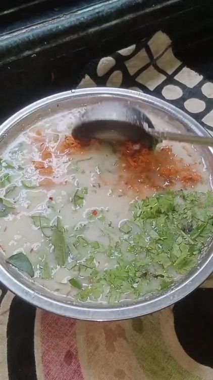 Step 1.2: Add curry leaves, chopped green chillies, chopped coriander leaves, chopped onion, and grated carrot to the batter