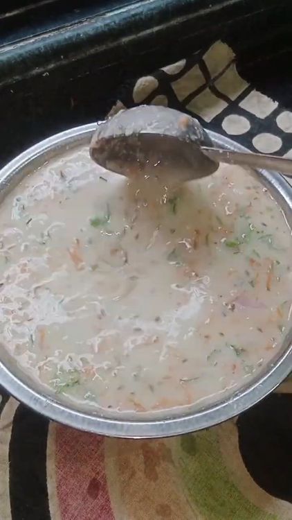 Step 1.3: Add curry leaves, chopped green chillies, chopped coriander leaves, chopped onion, and grated carrot to the batter