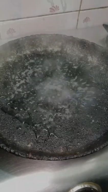 Step 2.1: Heat a dosa tawa and splash a few drops of water to check the temperature