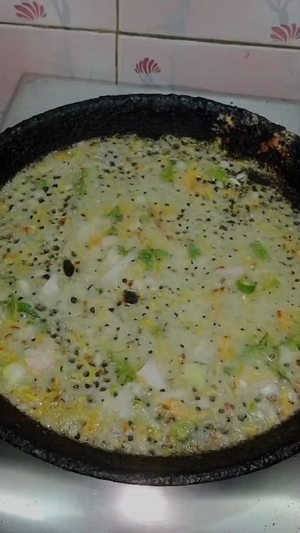Step 2.3: Pour the batter evenly over the hot tawa