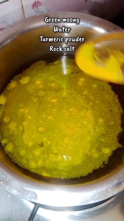 Step 1.2: In a bowl, add green moong, turmeric powder, rock salt, and water