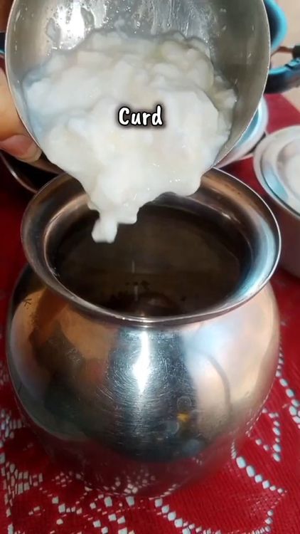 Step 2.1: In a steel jar, add curd, salt to taste, gram flour, and water