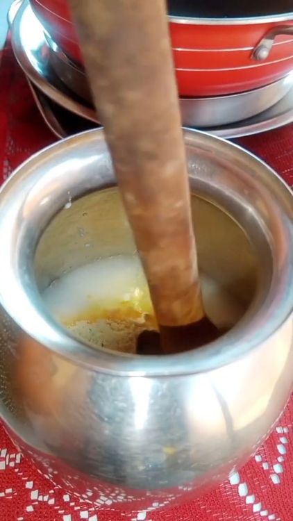 Step 2.3: In a steel jar, add curd, salt to taste, gram flour, and water