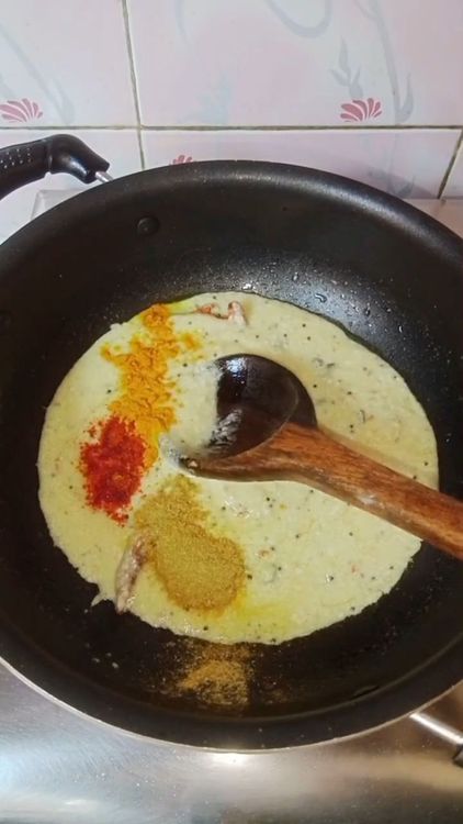 Step 3.2: Add the curd mixture along with turmeric powder, red chilli powder, and coriander powder