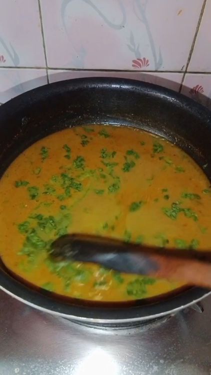 Step 2.2: Once the curry boils, add chopped coriander leaves, turn off the flame, and let the curry rest for some time before serving