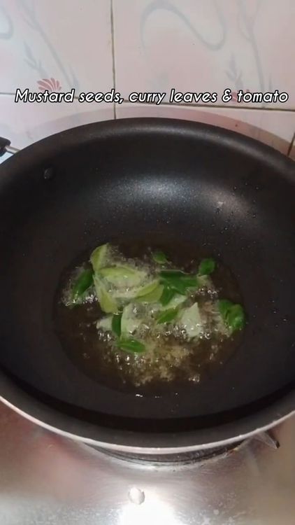 Step 2.1: Heat oil in a pan and crackle mustard seeds