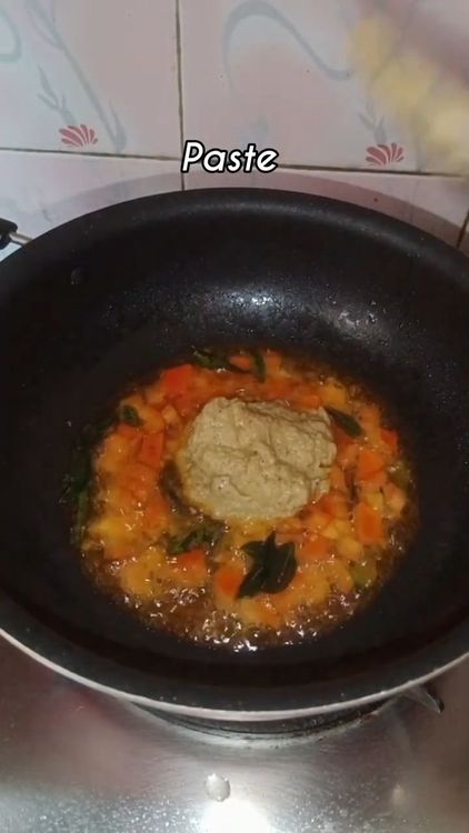 Step 2.1: Once the tomato moistens, add the prepared curry paste and fry until oil separates from the sides