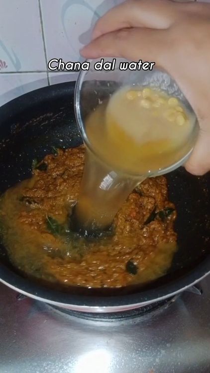 Step 2.1: Add hot chana dal water and mix well