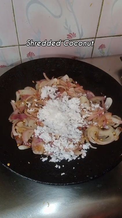 Step 1.1: Add grated coconut, fry well for 2-3 min