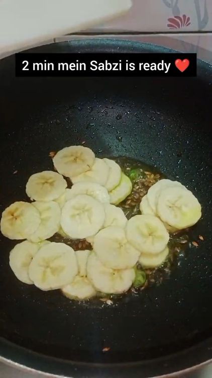 Step 1.1: Add the sliced raw bananas and toss for a few minutes