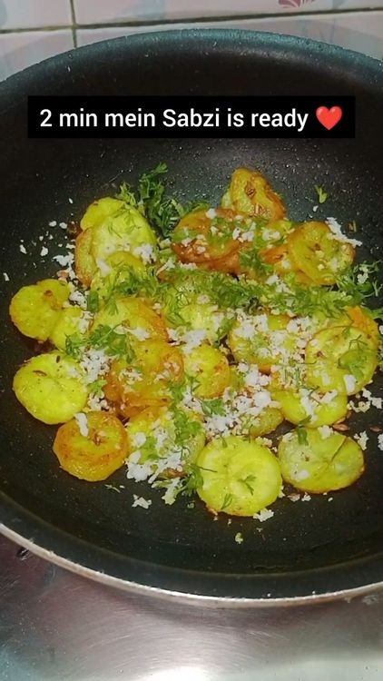 Step 1.1: Once the bananas are fried well, add grated coconut and chopped coriander leaves
