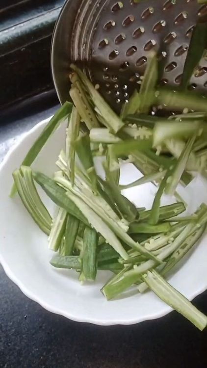 Step 1.1: Add turmeric powder, red chilli powder, black pepper powder, and a pinch of salt to the bhindi