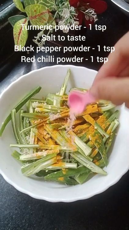 Step 1.2: Add turmeric powder, red chilli powder, black pepper powder, and a pinch of salt to the bhindi