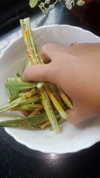Step 1.3: Add turmeric powder, red chilli powder, black pepper powder, and a pinch of salt to the bhindi