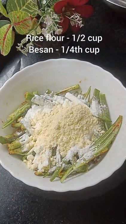 Step 1.1: Add rice flour and besan (chickpea flour) to the spiced bhindi and mix thoroughly