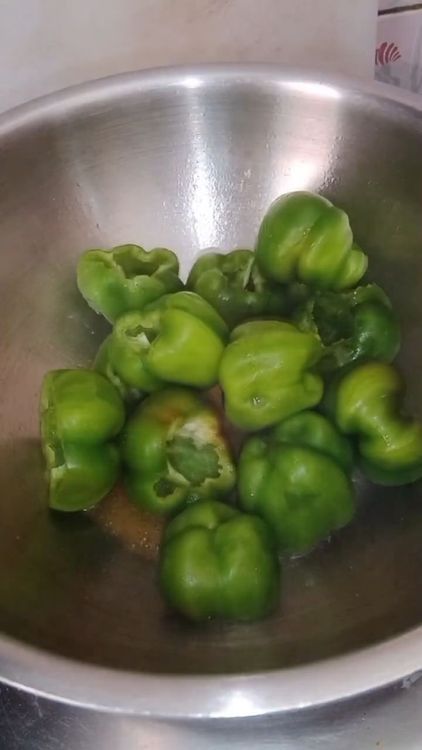 Step 1.2: Cut open the caps of the capsicum and remove the seeds