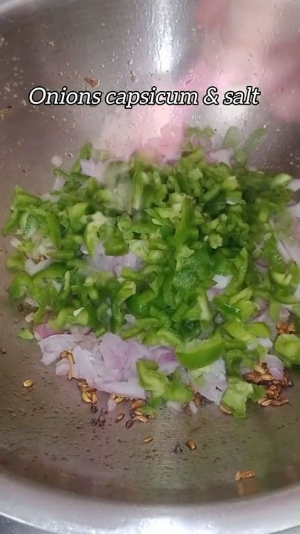 Step 2.1: Add finely chopped onions, finely chopped capsicum, and salt to taste