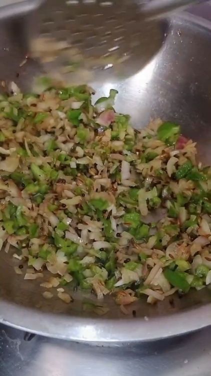 Step 2.2: Add finely chopped onions, finely chopped capsicum, and salt to taste