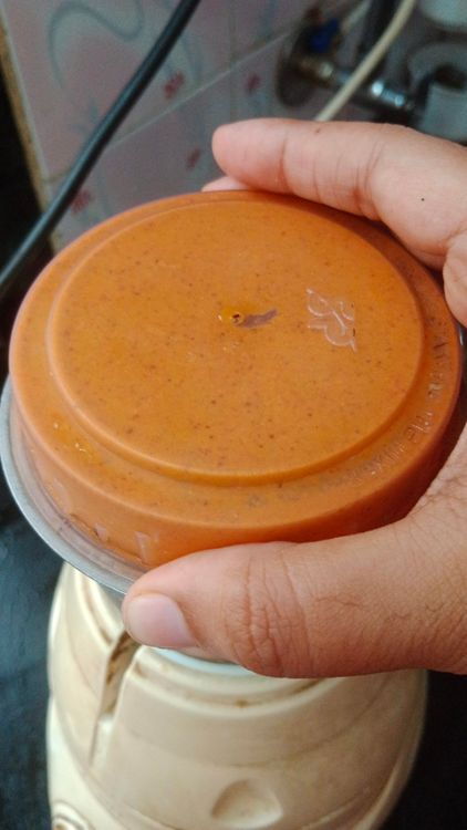 Step 1.1: In a mixie jar, add shredded coconut, dry roasted Kashmiri red chilli, turmeric powder, coriander seeds, tamarind piece, and water