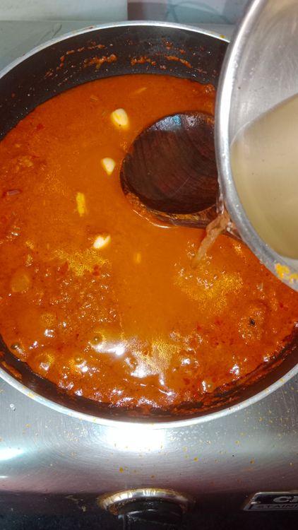 Step 2.1: Add water to the mixie jar and pour it into the pan