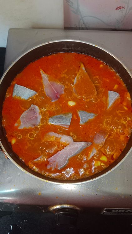 Step 2.2: Add fish pieces, cover, and cook for 2-3 minutes