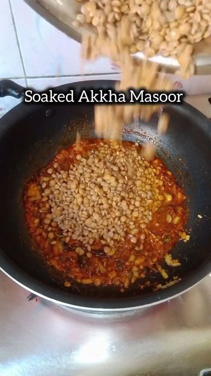 Step 1.1: Add soaked masoor, Add tomato and cook till it softens