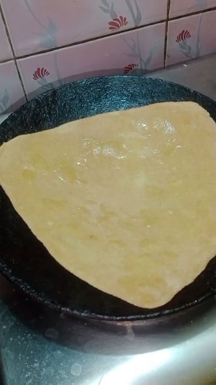 Step 3.1: Heat a tawa well and place the rolled chapati on it