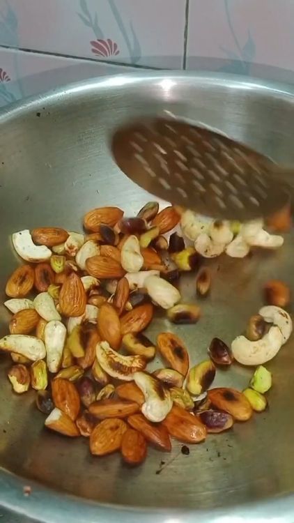 Step 1.1: Dry roast the mix of dry fruits (cashews, almonds, pista, walnuts) in the pan
