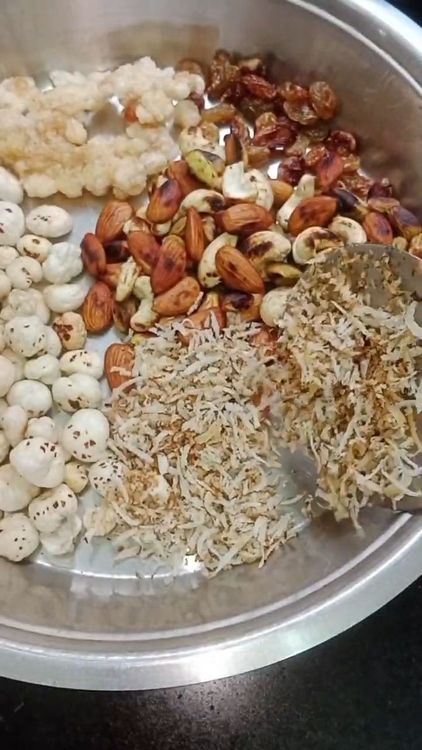 Step 1.2: Add shredded dry coconut to the pan and roast until it turns translucent