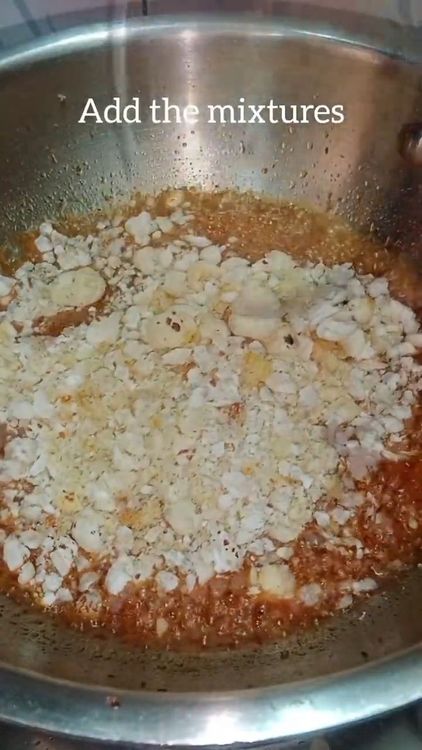 Step 4.1: Add the roasted ingredients (lotus seeds, edible gum, dry fruits, raisins, and dry coconut) to the jaggery syrup