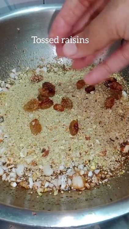 Step 4.2: Add the roasted ingredients (lotus seeds, edible gum, dry fruits, raisins, and dry coconut) to the jaggery syrup