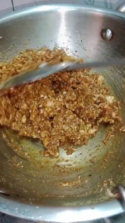 Step 4.4: Add the roasted ingredients (lotus seeds, edible gum, dry fruits, raisins, and dry coconut) to the jaggery syrup