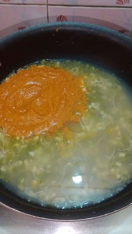 Step 2.1: When sprouts softens a bit , add the masala paste and boiled yam and give it a boil for 10 min