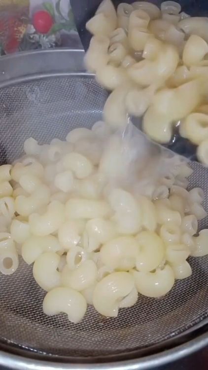 Step 1.1: Once the macaroni is cooked, strain it and rinse with cold water