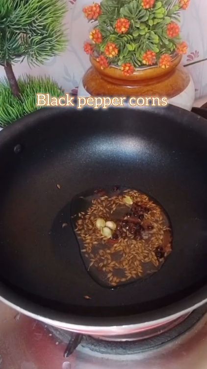 Step 1.1: Heat oil in a pan and crackle cumin seeds, cloves, and black pepper corns