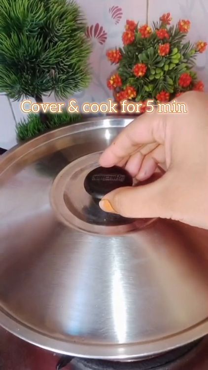 Step 1.2: Pour in water, cover the pan, and cook for 5 minutes