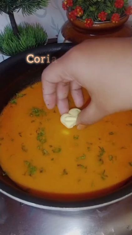 Step 1.3: Bring the strained soup to a boil with a pinch of salt, sugar, coriander leaves, and butter