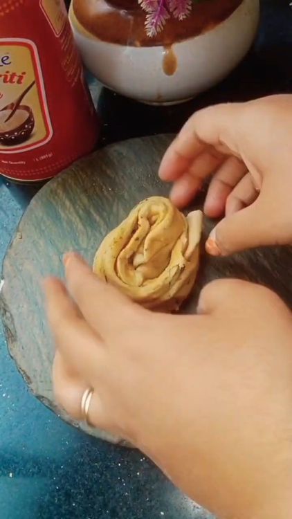 Step 2.1: Roll into a spiral (Swiss roll style) and tuck the end under