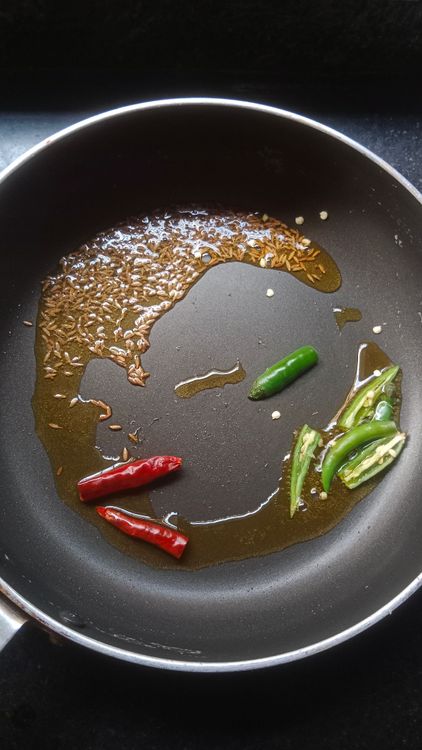 Step 3.1: Heat 1 tbsp oil and temper 1 tsp cumin seeds, 2 green chillies, and 1 dry red chilli