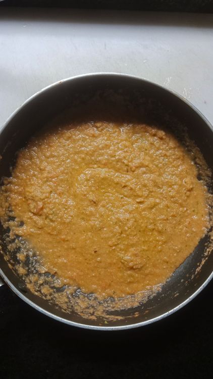 Step 2.3: Grind tomato and soaked cashews into a fine paste and add it to the cooked onion paste