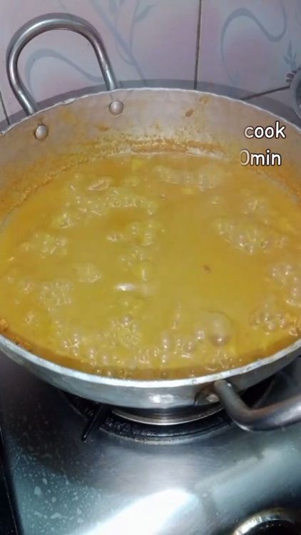 Step 3.3: Add the coconut paste to the boiling mixture of yam and red moong