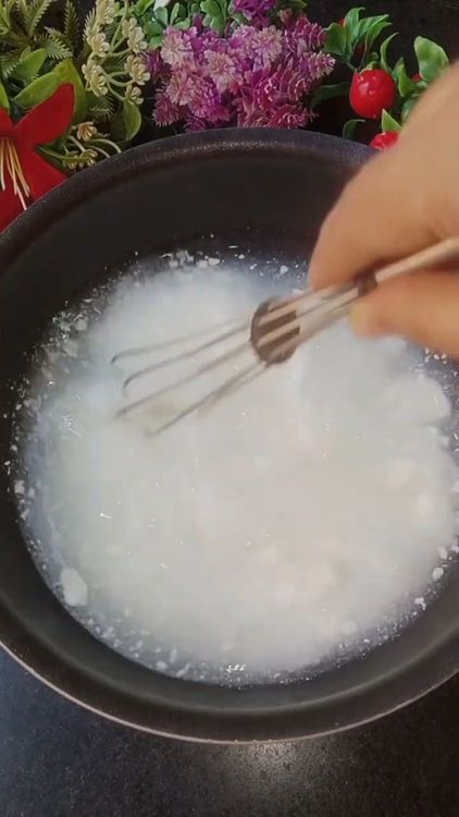 Step 1.3: In a bowl, add 4 cups of homemade thick curd and 2 cups of water
