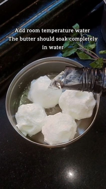 Step 1.1: After churning, knead and wash the butter in chilled water several times until the water runs clear