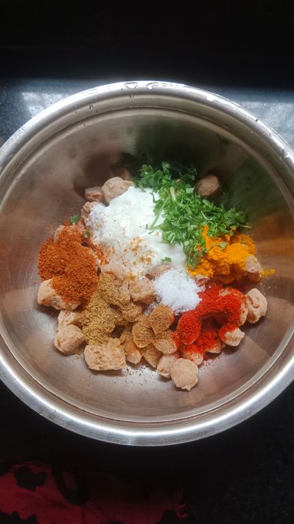 Step 1.1: Marinate the soya chunks with curd, turmeric powder, kashmiri red chilli powder, coriander cumin powder, pav bhaji masala, and salt