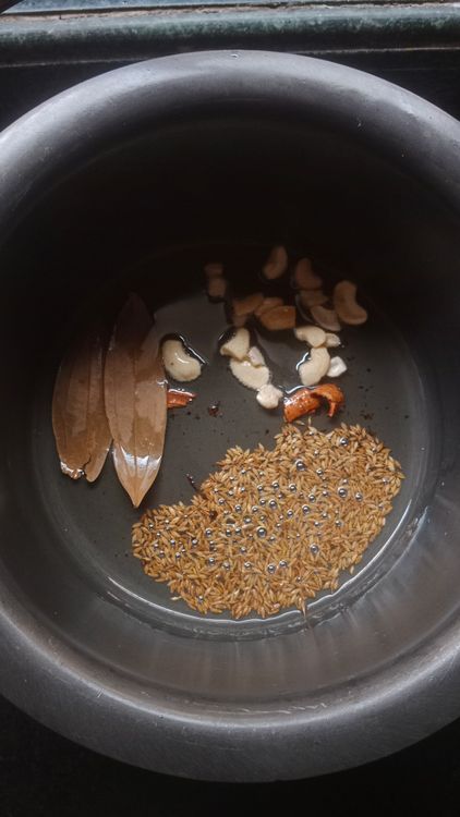 Step 2.1: Heat oil in a kadhai and temper cumin seeds, bay leaf, cinnamon stick, and cashews